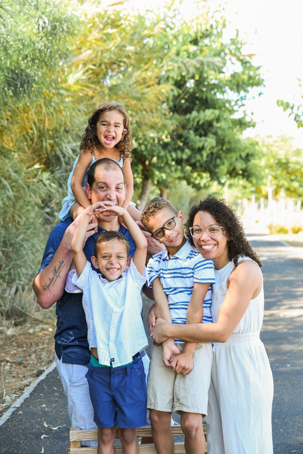Doron with Cynthia and their three kids outdoors in Israel